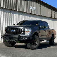 Thumbnail for 48002854 | Front Bumper with Fog Lights | Ford F-150 2021-Current showcasing rugged design and off-road capability
